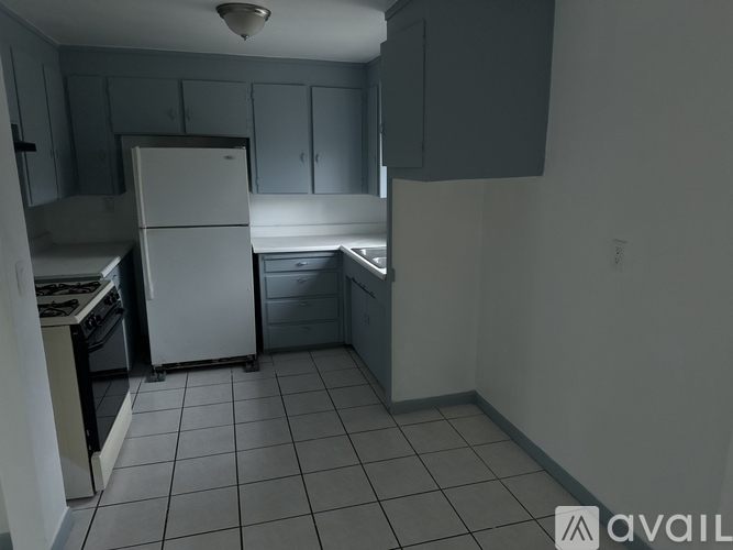A kitchen with a white refrigerator and a white oven.