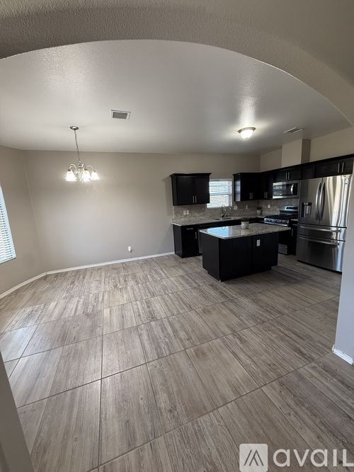 A kitchen with a tile floor and a countertop.