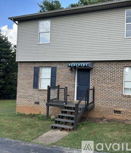 A house with a blue door and a porch.
