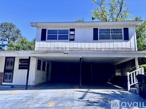 A two-story house with a garage is available for rent.