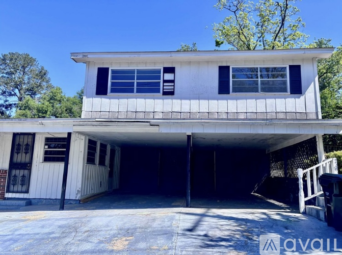 A two-story house with a garage is available for rent.