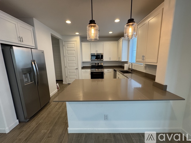 A modern kitchen with a large island in the center.