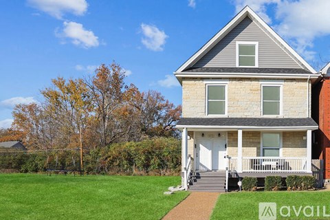 A house with a white door and a porch.