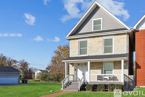 A house with a front porch and a white door.