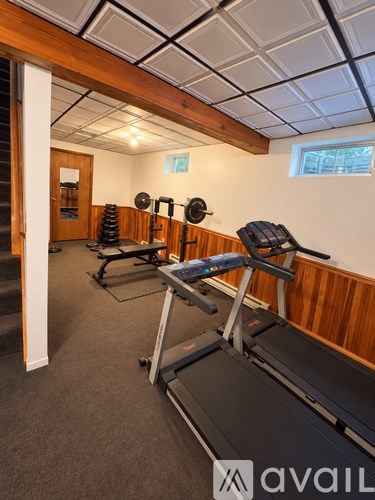 A gym with treadmills and weights.