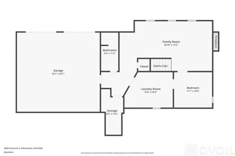 A floor plan of a house with a garage, laundry room, and storage space.