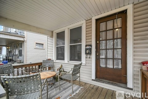 A patio with a table and chairs is available for rent.