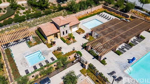 A house with a pool and a hot tub.