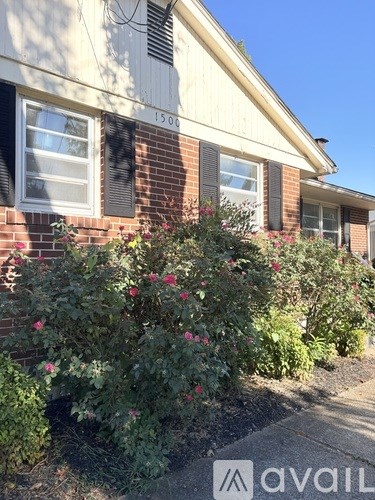 A house numbered 1500 with a garden in front.