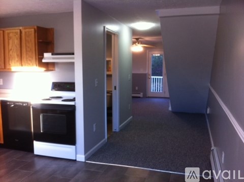 A kitchen with a black oven and a black microwave.