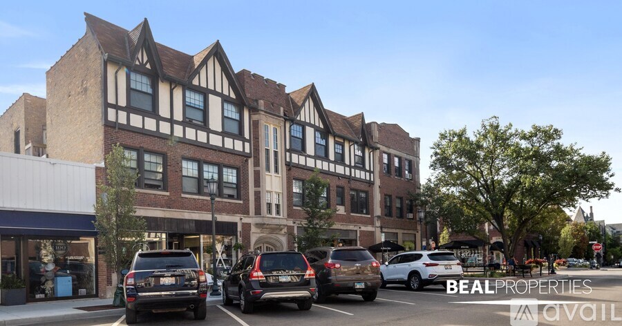 A street view of a building with cars parked in front and the words "BEALPROPERTIES AVAILABLE" on the image.