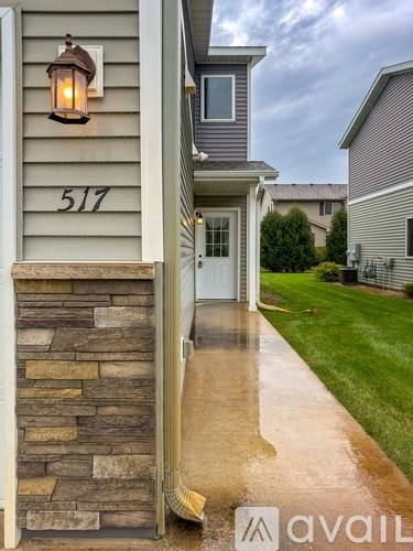 A house numbered 517 with a stone pillar in front.