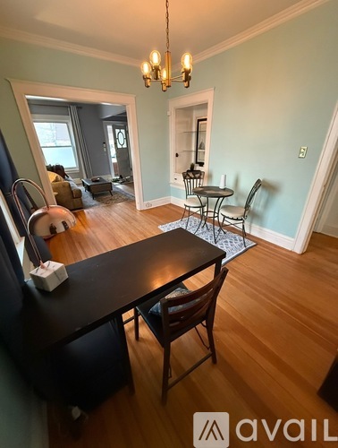 A room with a table and chairs in it.
