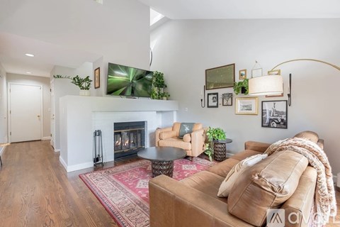 A living room with a fireplace and a couch.