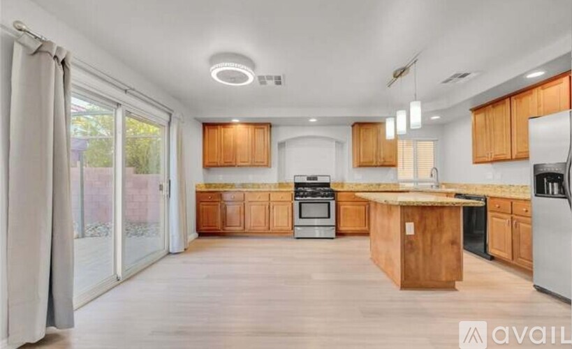 A kitchen with wooden cabinets and a central island.