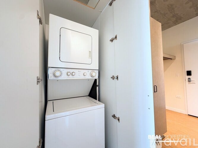 A white oven and dishwasher are built into a kitchen cabinet.