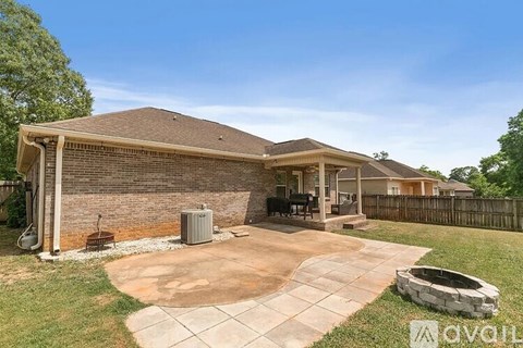 A house with a patio and a hot tub.
