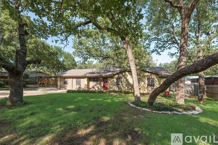 A house with a tree in front of it.