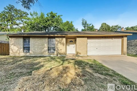 A house with a garage is for sale.