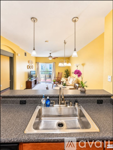 A kitchen with a sink and a window.