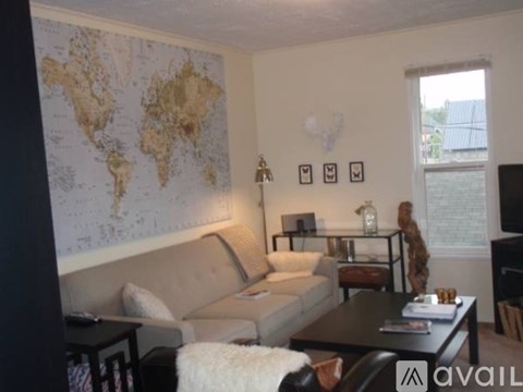 A living room with a world map on the wall.