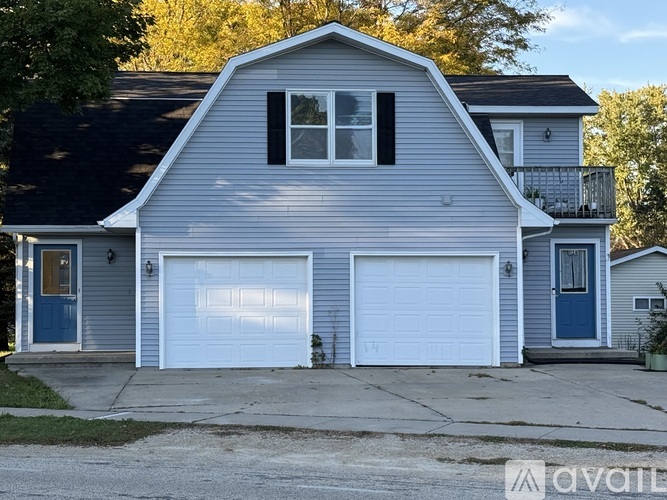 A two-car garage is attached to a house.