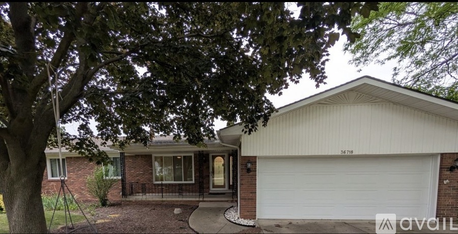 A house with a white garage door is for sale.