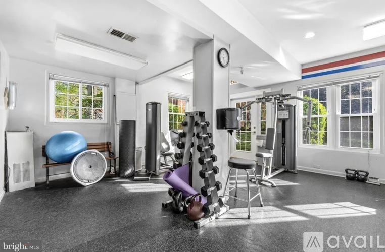 A well-equipped home gym with a variety of exercise equipment.