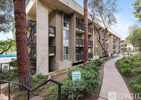 Apartment complex with a sign that says "For Rent".
