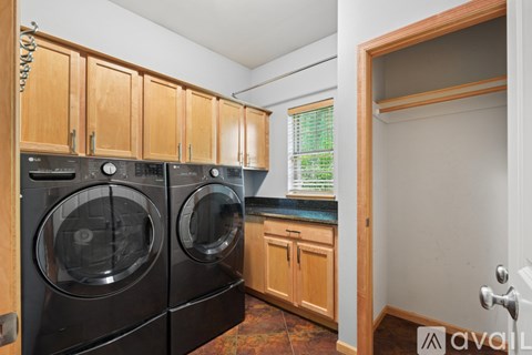 A laundry room with a washer and dryer.
