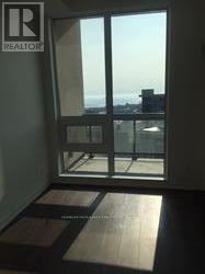 A window with a view of the cityscape outside.