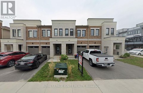 A building with the sign "Royal LePage Ignite Realty, Brokerage" in front of it.