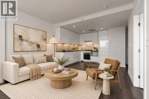 A modern living room with a large painting on the wall and a coffee table in the center.