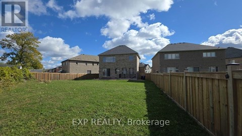 A real estate brokerage image of a residential area with houses and a fence.