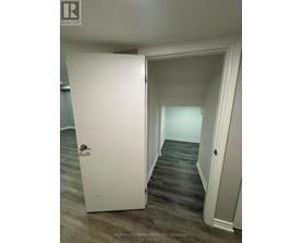 A white door is open to a hallway.