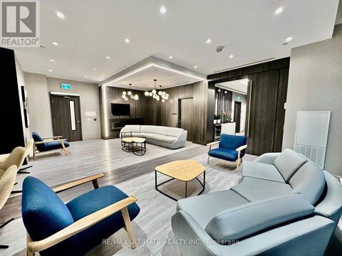 A living room with a grey sofa and blue chairs.