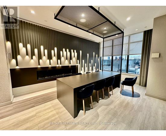 A modern office space with a long table and chairs.