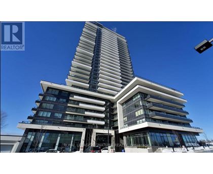 A tall, modern building with a curved design and multiple windows.