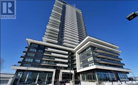 A tall, modern building with a curved design and multiple windows.