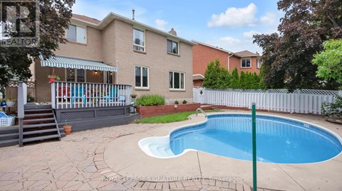 A house with a pool in the backyard.