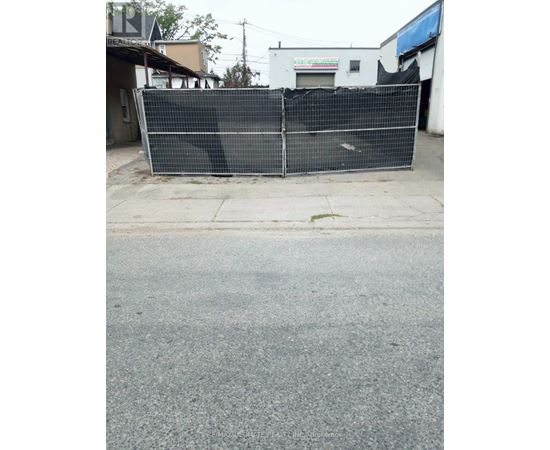 A black fence is blocking the entrance to a building.