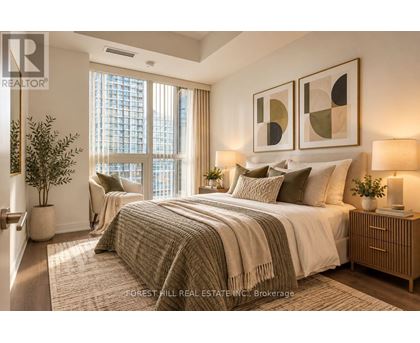 A well-lit bedroom with a large bed and a view of a city skyline.