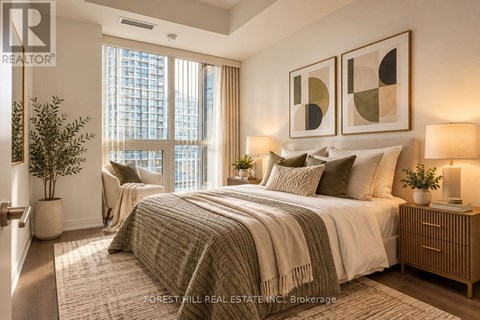 A well-lit bedroom with a large bed and a view of a city skyline.