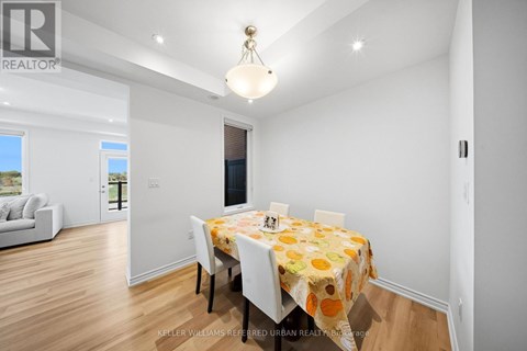 A dining room with a table set for four.