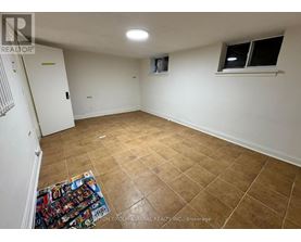 A room with a tiled floor and a window with a white frame.