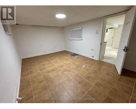 A room with a tiled floor and a radiator on the wall.