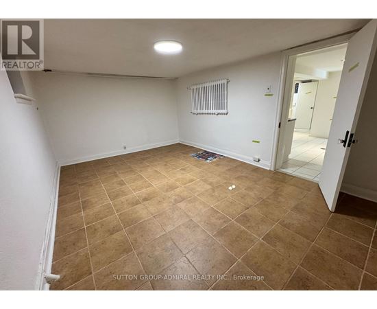 A room with a tiled floor and a radiator on the wall.