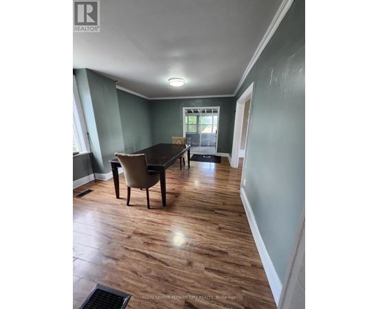 A room with a table and chairs in it.