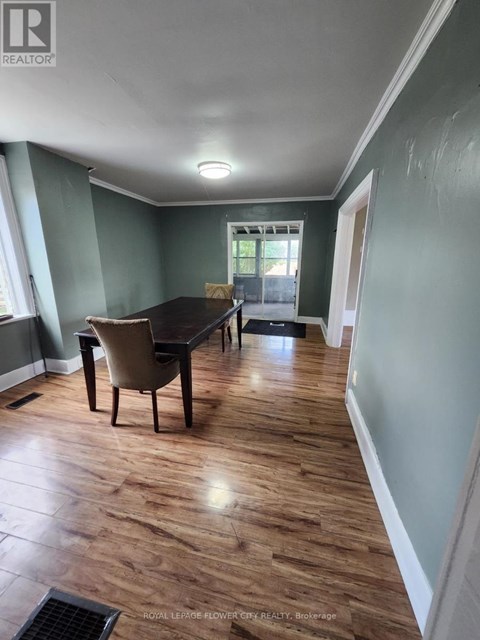 A room with a table and chairs in it.