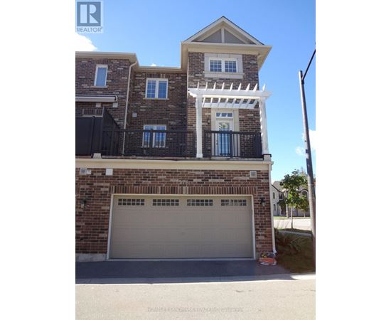 A two-story house with a garage is for sale.